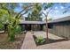 Home's entrance with a brick walkway and courtyard at 4834 Hall Rd, Orlando, FL 32817