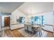 Dining room with hardwood floors, chandelier, and large windows at 4834 Hall Rd, Orlando, FL 32817