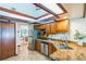 Modern kitchen featuring stainless steel appliances and granite countertops at 4834 Hall Rd, Orlando, FL 32817