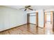 Large bedroom with double door closet and wood floors at 4834 Hall Rd, Orlando, FL 32817