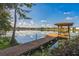 Wooden gazebo on a pier overlooking a lake at 4834 Hall Rd, Orlando, FL 32817