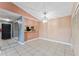 Spacious dining area with tile floors and kitchen pass-through at 5208 Via Hacienda Cir # 201, Orlando, FL 32839