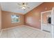 Second bedroom with tile floors and two windows at 5208 Via Hacienda Cir # 201, Orlando, FL 32839