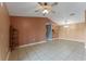 Spacious dining room with tile flooring and a view into the kitchen at 5208 Via Hacienda Cir # 201, Orlando, FL 32839