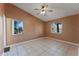 Bright bedroom featuring tile floors and a ceiling fan at 5208 Via Hacienda Cir # 201, Orlando, FL 32839