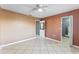 Well-lit bedroom with tile flooring and ceiling fan at 5208 Via Hacienda Cir # 201, Orlando, FL 32839