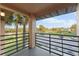 Private balcony overlooking a lush green landscape at 5208 Via Hacienda Cir # 201, Orlando, FL 32839