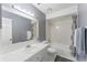 Clean bathroom with a tub, shower, and updated vanity at 5208 Via Hacienda Cir # 201, Orlando, FL 32839