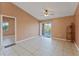 Spacious living room with tile floors and access to balcony at 5208 Via Hacienda Cir # 201, Orlando, FL 32839