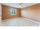 Spacious bedroom with tile flooring and ceiling fan at 5208 Via Hacienda Cir # 201, Orlando, FL 32839