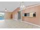 Living room with tile floors, sliding glass doors, and ceiling fan at 5208 Via Hacienda Cir # 201, Orlando, FL 32839