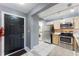 Entryway with view into kitchen and laundry area at 5208 Via Hacienda Cir # 201, Orlando, FL 32839
