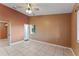 Large bedroom with tile floors, a ceiling fan, and a walk-in closet at 5208 Via Hacienda Cir # 201, Orlando, FL 32839