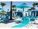 Community pool with cabanas and lounge chairs at 8881 Qin Loop, Kissimmee, FL 34747
