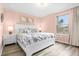 Spacious bedroom with a king-size bed and soft color scheme at 8881 Qin Loop, Kissimmee, FL 34747