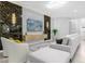 Living room with sectional sofa and large TV at 8881 Qin Loop, Kissimmee, FL 34747