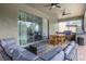 Outdoor patio with seating, grill, and pool view at 8881 Qin Loop, Kissimmee, FL 34747