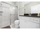 Bathroom with walk in shower, toilet, and granite countertop vanity at 8881 Qin Loop, Kissimmee, FL 34747