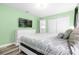 Bedroom with queen bed, dresser and large TV at 8881 Qin Loop, Kissimmee, FL 34747
