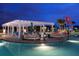Tranquil resort pool with relaxing seating areas at 8881 Qin Loop, Kissimmee, FL 34747