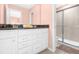 Bathroom with double vanity and walk-in shower at 8881 Qin Loop, Kissimmee, FL 34747