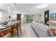 Open concept living room and kitchen with access to the pool at 8881 Qin Loop, Kissimmee, FL 34747