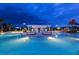 Stunning nighttime view of resort pool and pergola at 8881 Qin Loop, Kissimmee, FL 34747