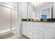 Bathroom with double vanity and walk-in shower at 8881 Qin Loop, Kissimmee, FL 34747