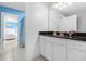 Clean bathroom with white cabinets and dark granite countertop at 8881 Qin Loop, Kissimmee, FL 34747