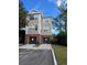 Tan three-story building with two-car garages at 13103 Mulberry Park Dr # 817, Orlando, FL 32821