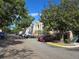 Apartment building with parking lot and landscaping at 13103 Mulberry Park Dr # 817, Orlando, FL 32821
