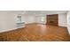 Spacious living room with hardwood floors and brick fireplace at 1419 Ne 21St St, Ocala, FL 34470