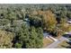 Aerial view of neighborhood with lush trees at 1419 Ne 21St St, Ocala, FL 34470