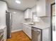 Modern kitchen with white cabinets, quartz counters, and stainless steel appliances at 1419 Ne 21St St, Ocala, FL 34470