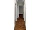Bright hallway with wood-look flooring and access to multiple rooms at 1419 Ne 21St St, Ocala, FL 34470