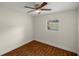 Charming bedroom with wood-look floors, ceiling fan and window with blinds at 1419 Ne 21St St, Ocala, FL 34470