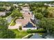 An aerial view of a home with solar panels and a pool at 1869 Merlot Dr, Sanford, FL 32771