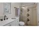 Bathroom with white vanity, shower, and window at 1869 Merlot Dr, Sanford, FL 32771