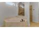 Bathroom with a large corner bathtub at 1869 Merlot Dr, Sanford, FL 32771