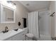 Bathroom with white vanity, shower, and curtain at 1869 Merlot Dr, Sanford, FL 32771