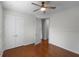 Well-lit bedroom with hardwood floors and double door closet at 1869 Merlot Dr, Sanford, FL 32771