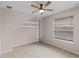 Bedroom with hardwood floors, built-in shelving, and window at 1869 Merlot Dr, Sanford, FL 32771