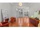 Sunlit entryway with hardwood floors and statement art at 1869 Merlot Dr, Sanford, FL 32771