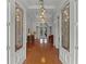 Bright and spacious entry with hardwood floors and elegant light fixture at 1869 Merlot Dr, Sanford, FL 32771