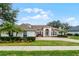 House with a double door entry and manicured landscaping at 1869 Merlot Dr, Sanford, FL 32771