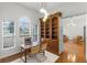Home office with built-in bookcase and hardwood floors at 1869 Merlot Dr, Sanford, FL 32771