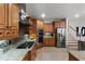 Modern kitchen with stainless steel appliances and granite countertops at 1869 Merlot Dr, Sanford, FL 32771