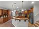 Spacious kitchen with island, stainless steel appliances, and granite countertops at 1869 Merlot Dr, Sanford, FL 32771