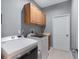 Laundry room with washer, dryer, cabinets, and sink at 1869 Merlot Dr, Sanford, FL 32771