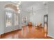Spacious living room with hardwood floors and double doors at 1869 Merlot Dr, Sanford, FL 32771